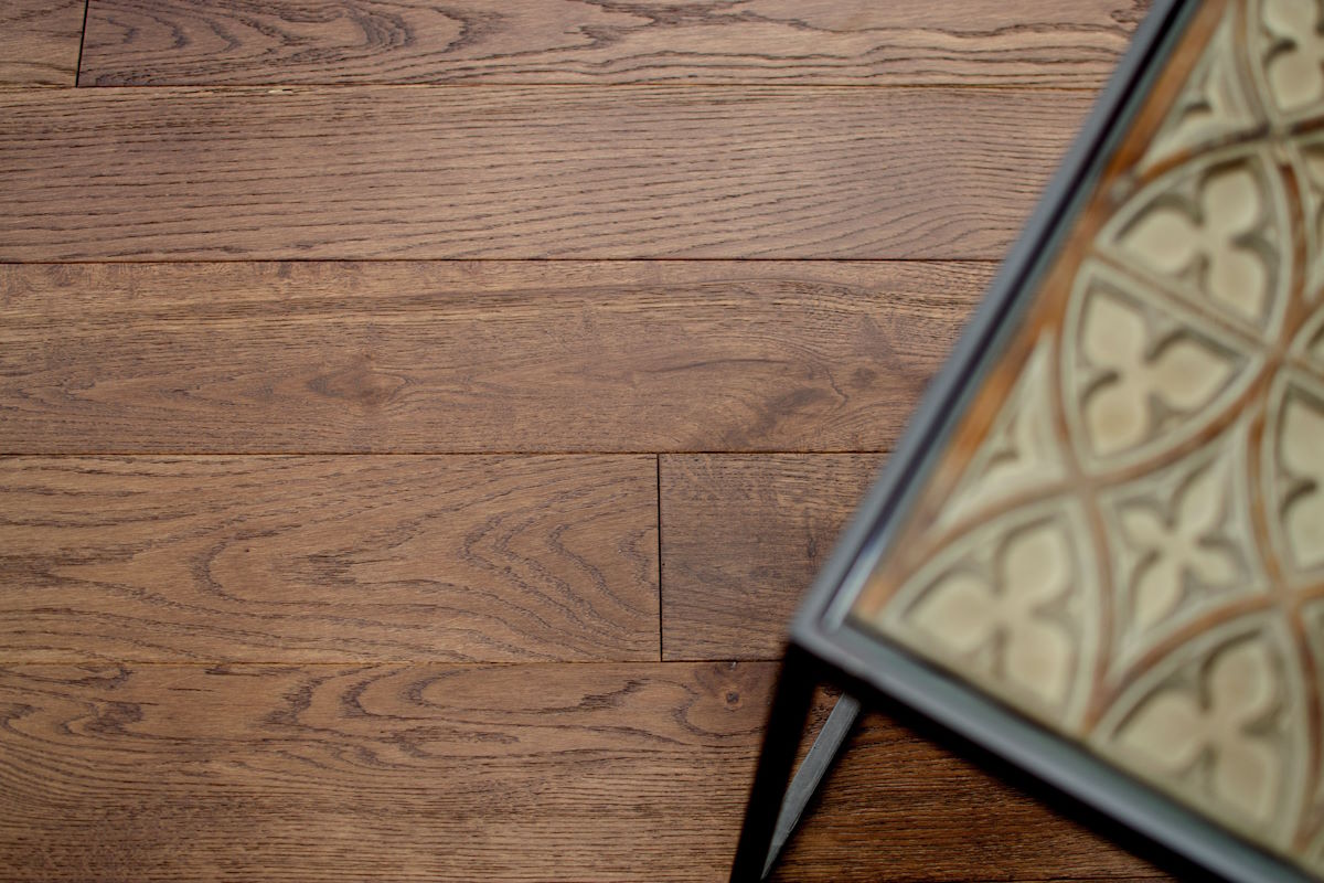 Wide-plank wood flooring with natural oak character